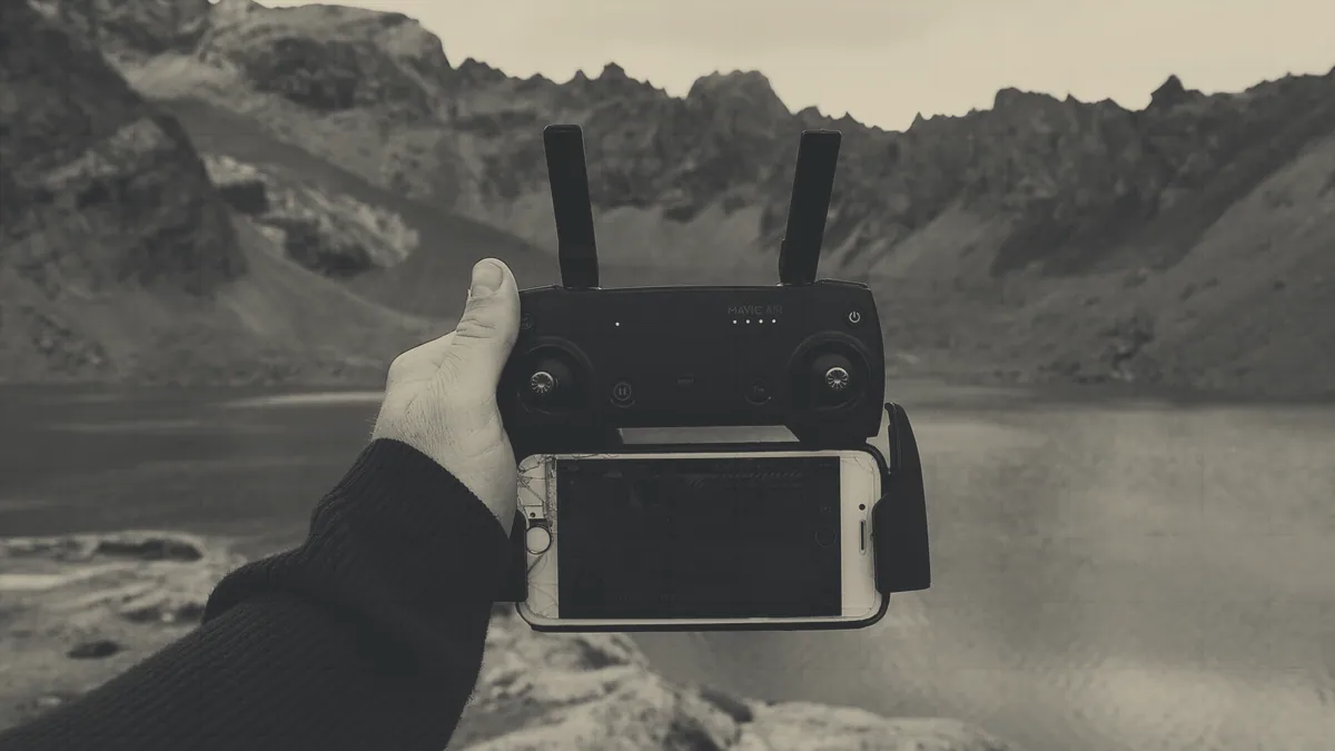 A flyer working the sticks of a transmitter.