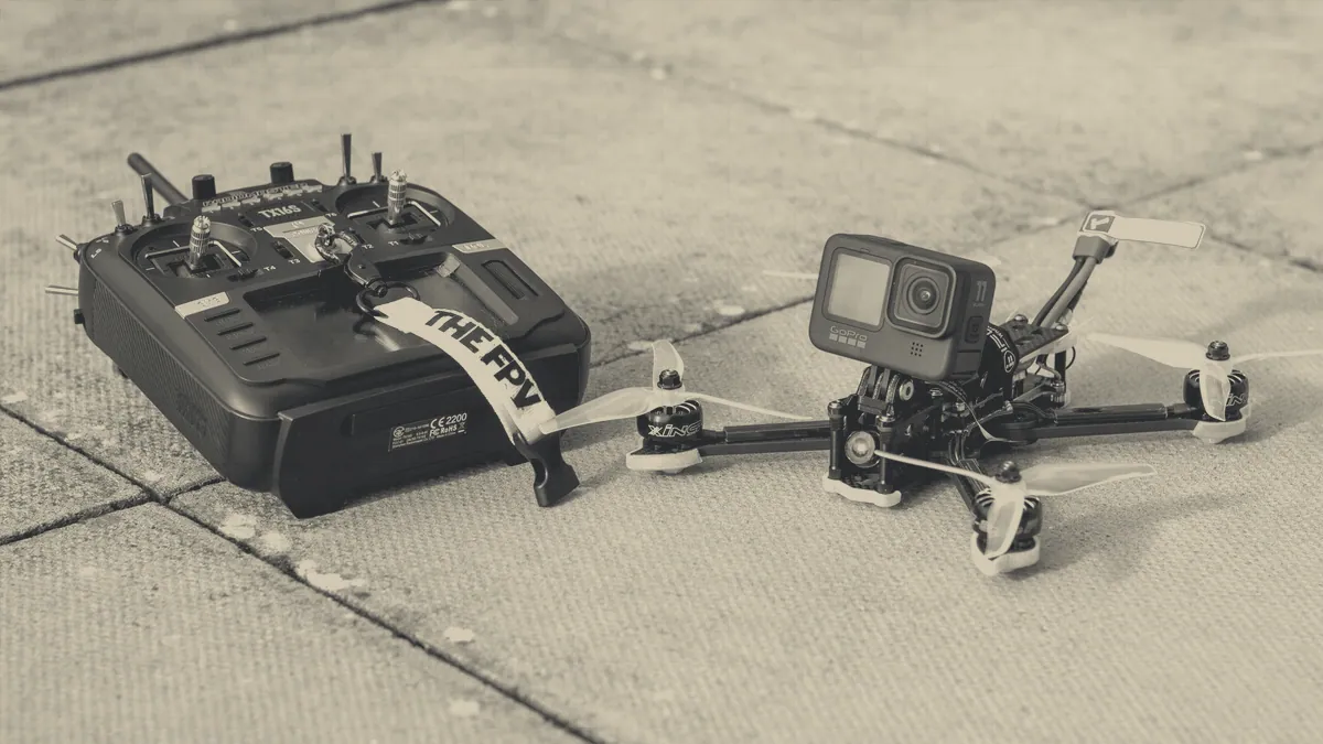 A racing quad with exposed motors and arms.