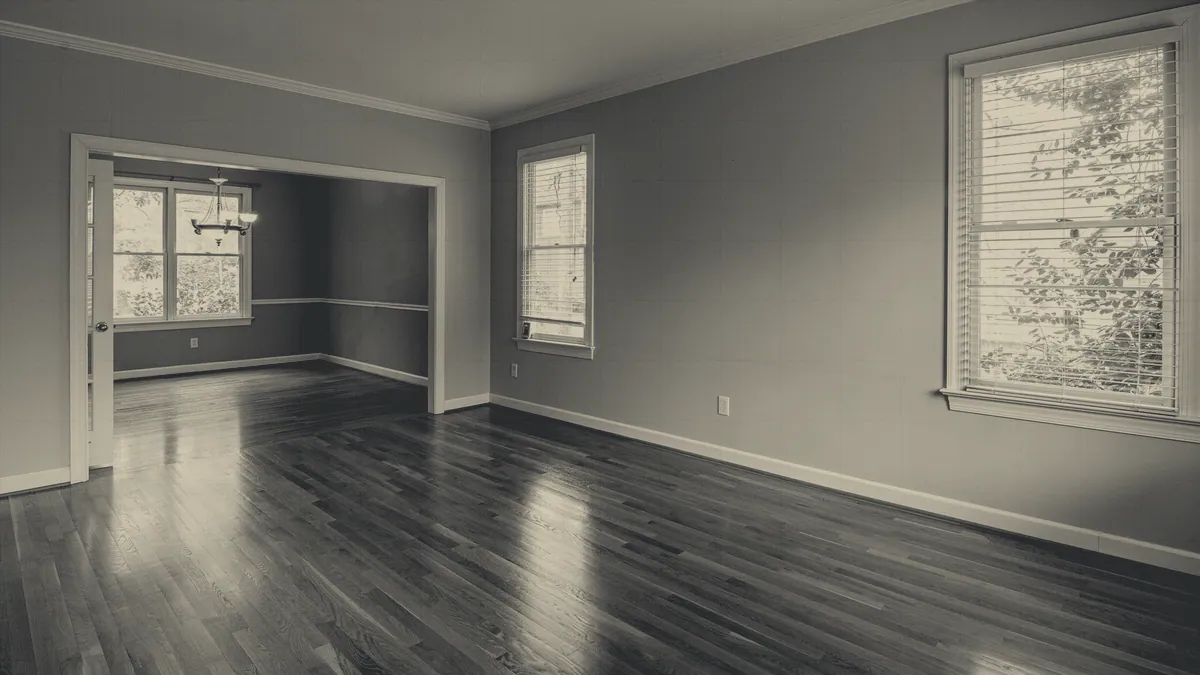 An indoor room with furniture and a low ceiling.