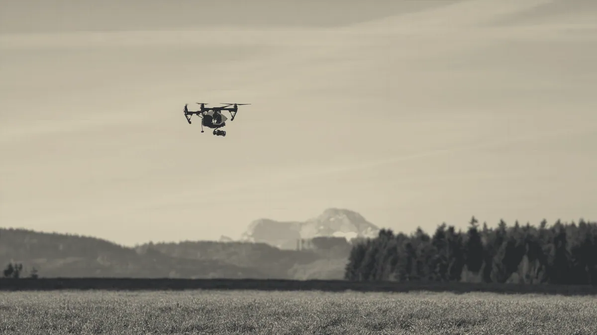 A flyer standing in an open field.