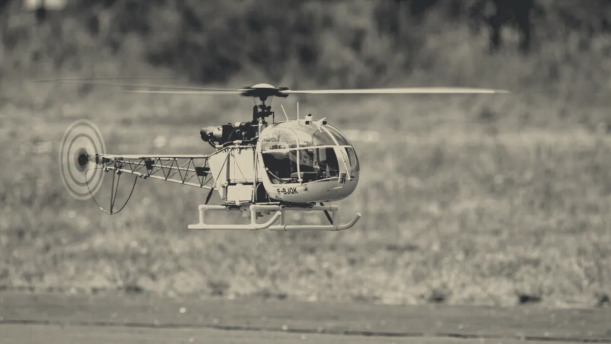 A model helicopter on the ground.